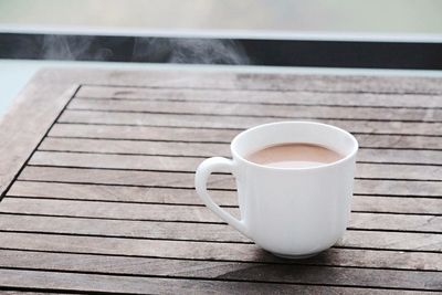 Close-up of coffee cup on table