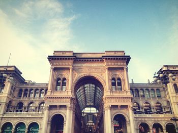 Low angle view of historic building against cloudy sky