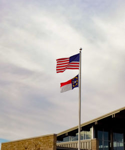 Low angle view of flag against sky