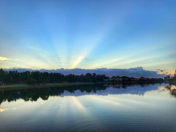 Scenic view of lake against blue sky