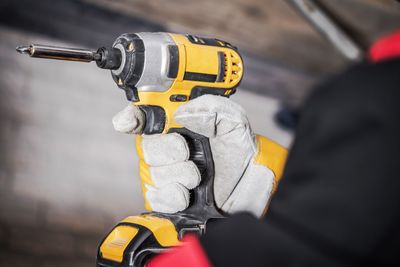 Cropped image of man repairing car