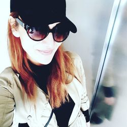 Portrait of young woman wearing sunglasses