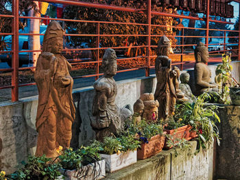 Statue against stone wall