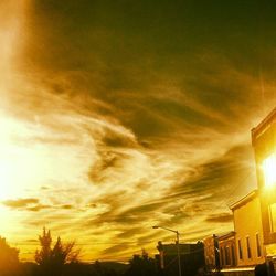 Low angle view of building against sky at sunset