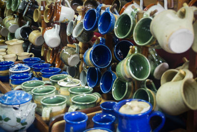 Close-up of various cups displayed for sale