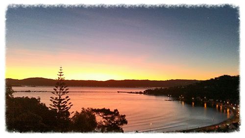 Scenic view of lake at sunset