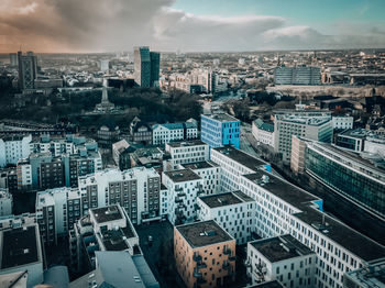 High angle view of modern buildings in city against sky