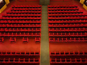 The red armchairs of a theater