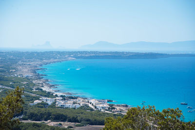 Scenic view of sea against clear blue sky