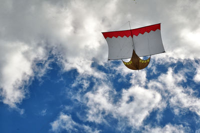 Low angle view of kite flying against sky