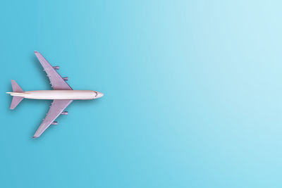 High angle view of airplane against blue sky