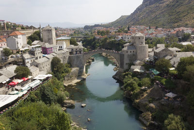 High angle view of river and cityscape against sky