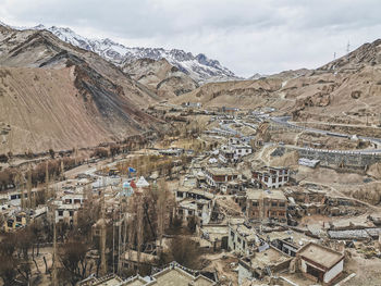 Aerial view of landscape with mountain range in background