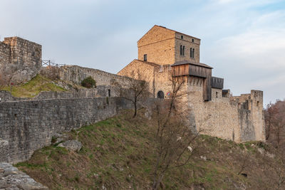 Sunset on the ancient castle of ragogna, italy. fortress guarding the ford on the river tagliamento