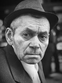 Close-up portrait of man wearing hat