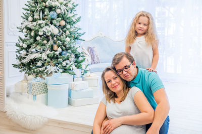 Smiling family at home