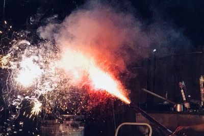 View of firework display at night