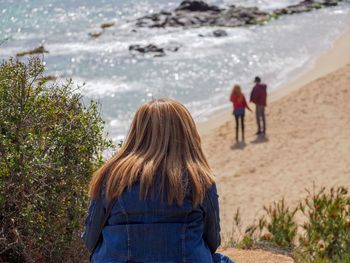 Rear view of girl at beach