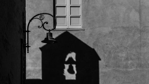 Shadow of hand on window