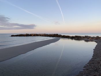 Scenic view of sea against sky during sunset