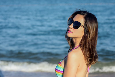 Woman wearing sunglasses at beach