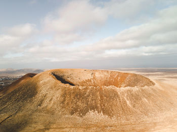 Scenic view of volcano against sky