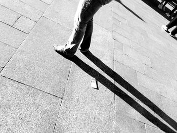 Low section of man walking outdoors