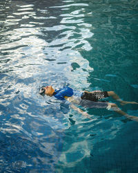 High angle view of man swimming in sea