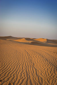 Scenic view of desert against clear sky