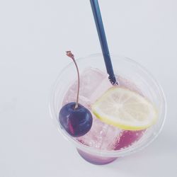 Close-up of drink over white background