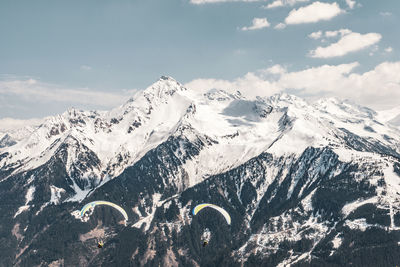 Scenic view of snowcapped mountains against sky