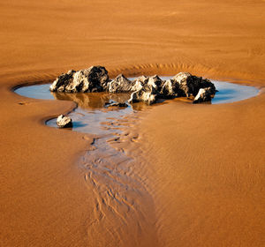 High angle view of rock formations at beach