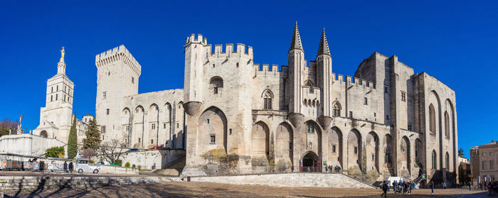 Panoramic view of historic building against blue sky