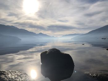 Low angle view of sea against sky during sunset