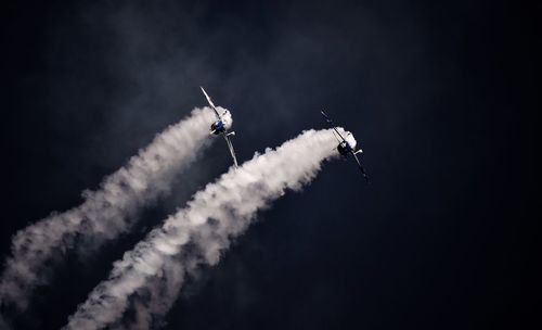 Low angle view of airshow in sky