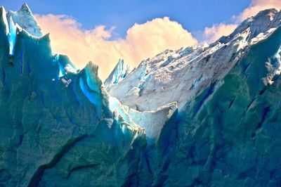 Close-up of glacier on mountain against sky