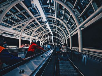 Low angle view of people standing in elevator