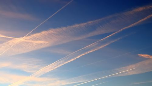 Low angle view of vapor trails in sky