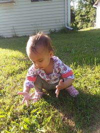 Cute girl playing on field