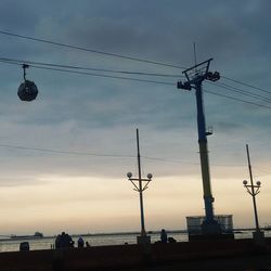 Low angle view of street light against sky