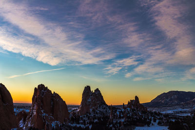 Scenic view of landscape against sky at sunset