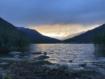 Scenic view of lake against sky during sunset