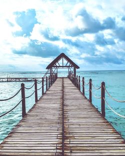 Pier over sea against sky