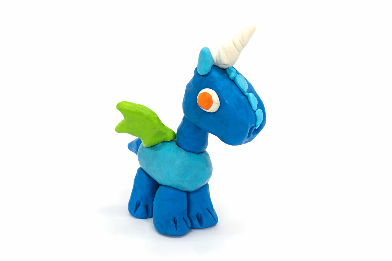 cartoon, animal figure, toy, blue, stuffed toy, representation, cut out, white background, animal representation, animal, plush, studio shot, indoors, no people, figurine, animal themes, creativity