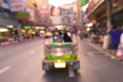 Vehicles on road in city at night