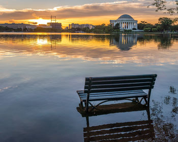 Sunrise over a flooded tidal basin with the jefferson memorial in the background.