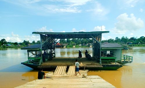 Pier over lake against sky