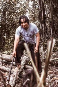 Full length of young man in forest