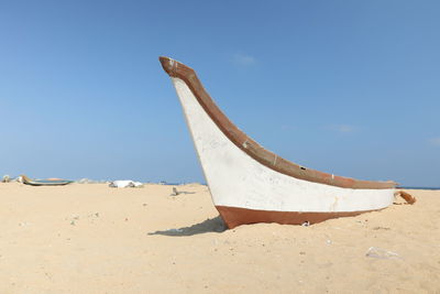 Scenic view of beach against blue sky