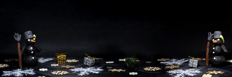 View of christmas decoration on table against black background